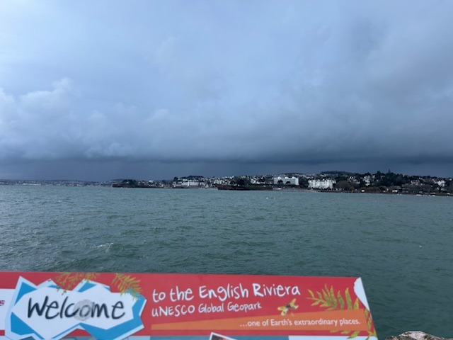 A photo of the sea with a banner saying welcome to the English Riviera